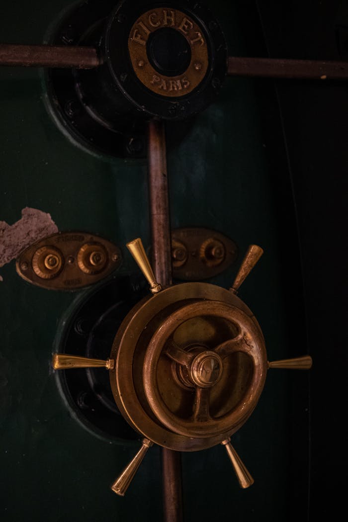 The Art of Drawing Readers In: Your attractive post title goes here Close-up of a vintage safe door with a brass handle and dark green surface.
