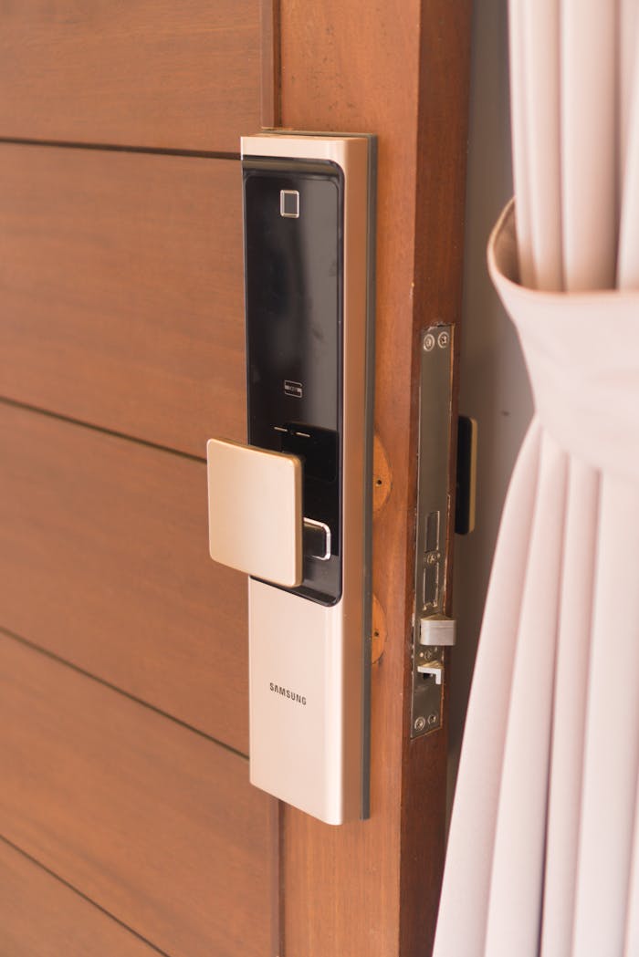 Mastering the First Impression: Your intriguing post title goes here Close-up of a smart door lock system, offering enhanced security on a wooden door.